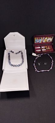 A selection of pearl necklaces and earings.