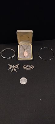 Various sterling silver items including rose quartz necklace, two bangles, and two vintage 