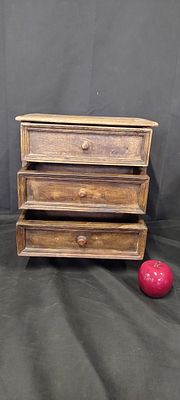 Small distressed solid wooden 3 drawer unit. Measures approx H 35 x W 33.5 x D 20 cm