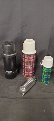 Various vintage flasks and a spare inner