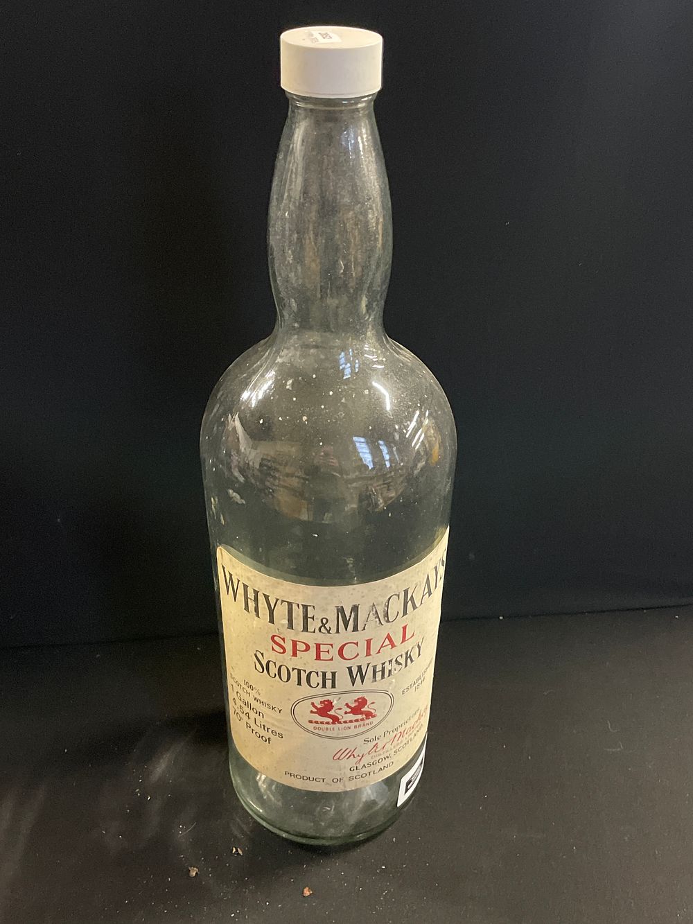 Lot 322: Large whiskey bottle savo
