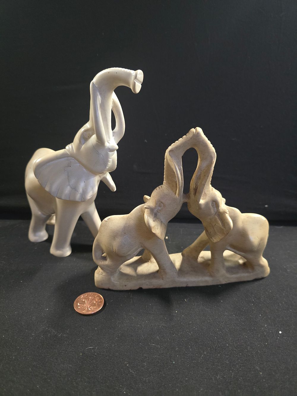 Lot 384: Two stone elephants