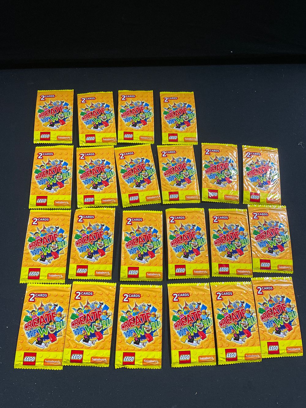 Lot 404: 20 unopened Lego create the world collectors cards