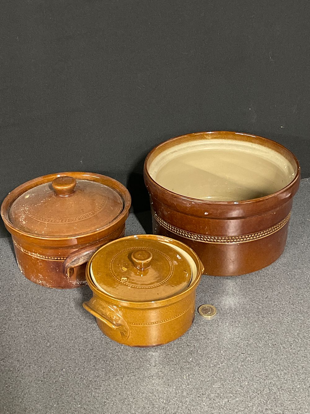 Lot 170: Selection of vintage brown stonewear cooking pots