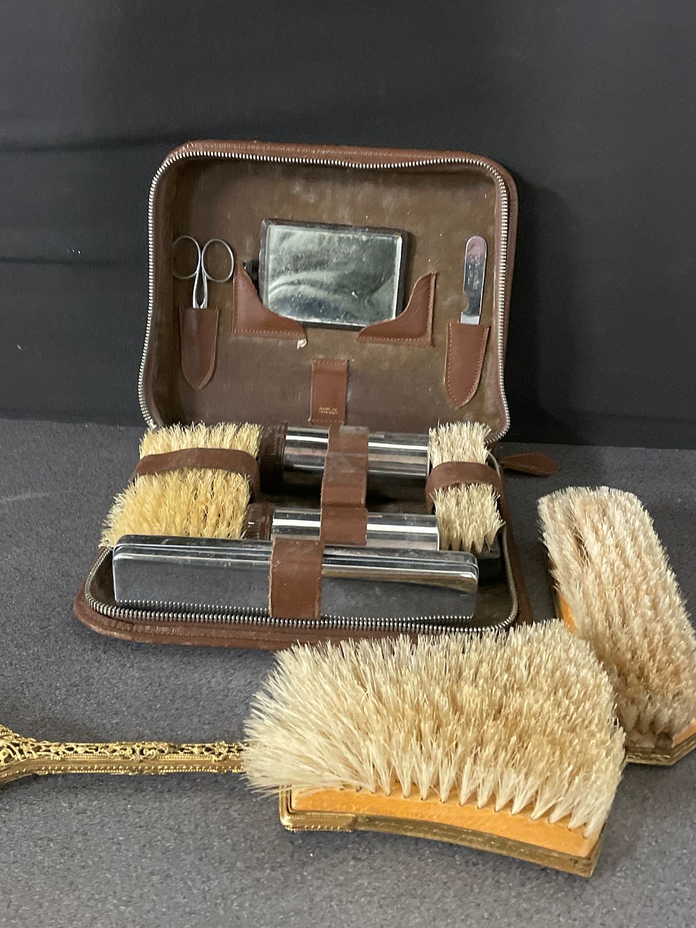 Lot 223: Gentleman’s  vintage travel kit and brushes