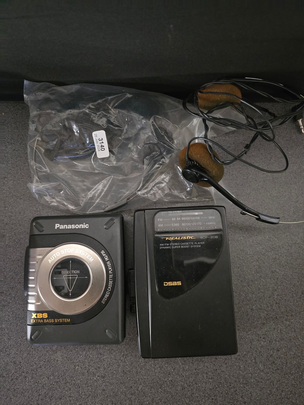 Lot 324: Two vintage cassette radios with head phones