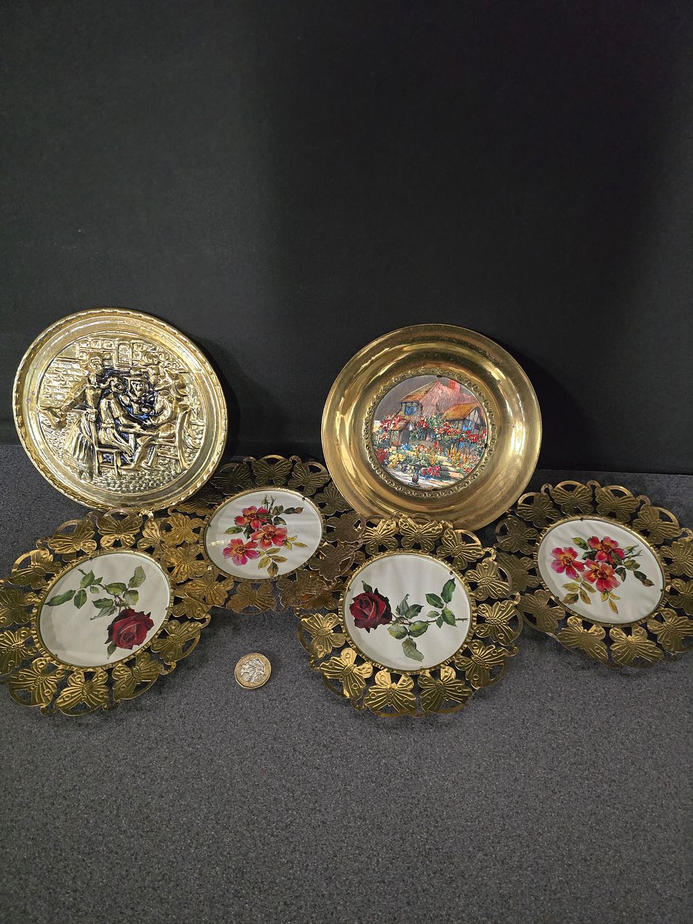 Lot 346: Six vintage brass wall hanging plates