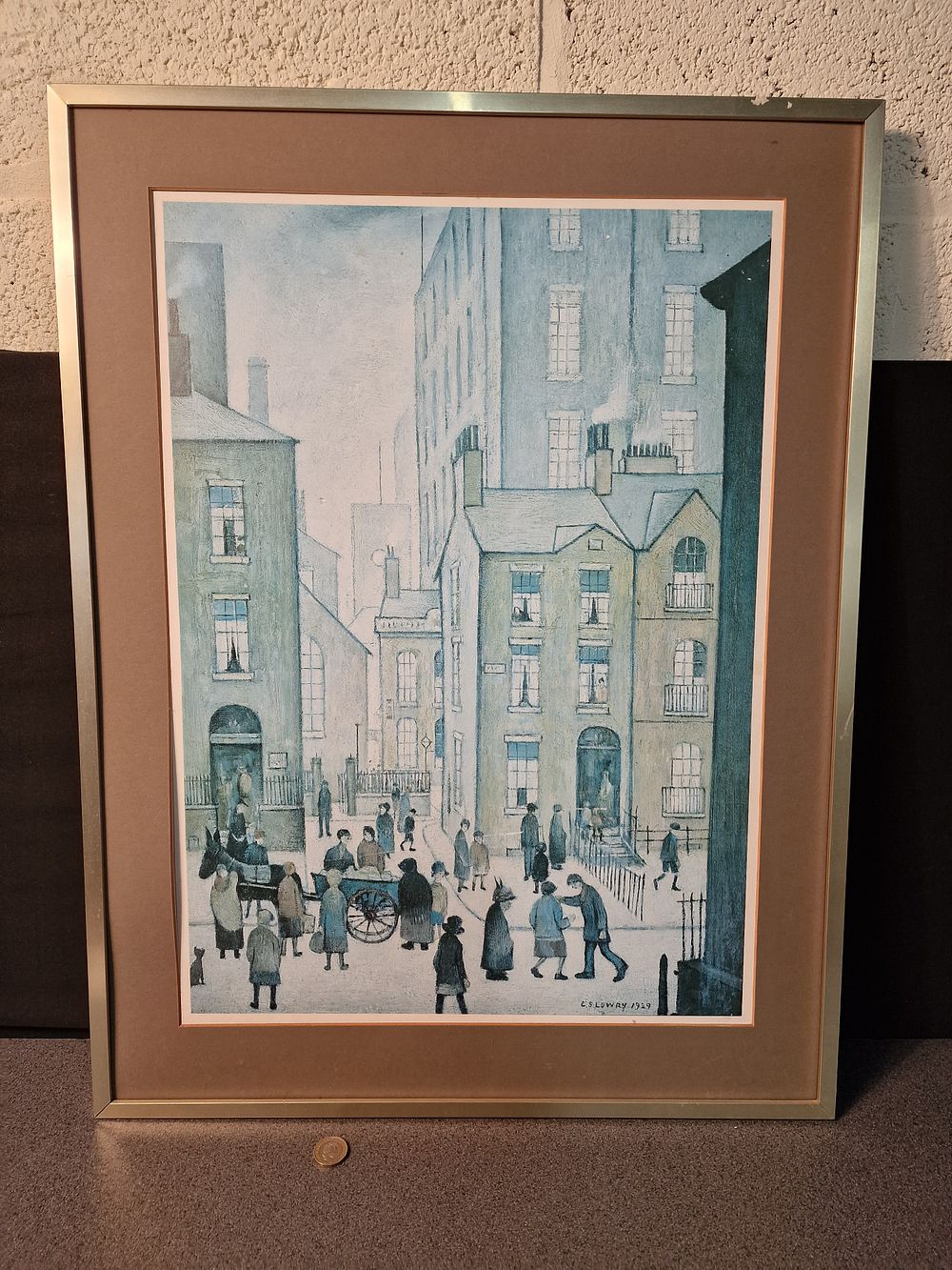 Lot 209: Framed L.S. Lowry print of Hawkers Cart. Measures approx H 69.5 x W 53.5 cm