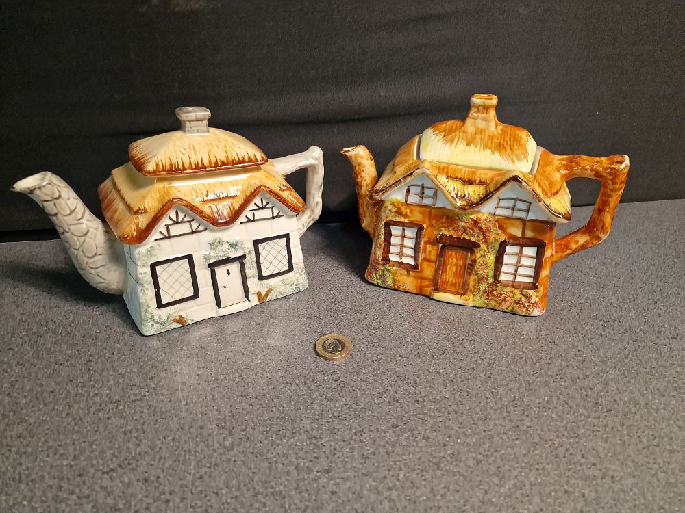 Lot 253: Pair of Keele St Pottery, Staffordshire Cottageware Teapots