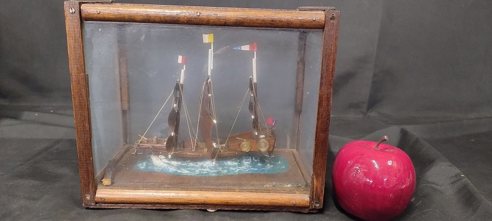 Lot 223: Miniature ship in a display box. Measures approx...