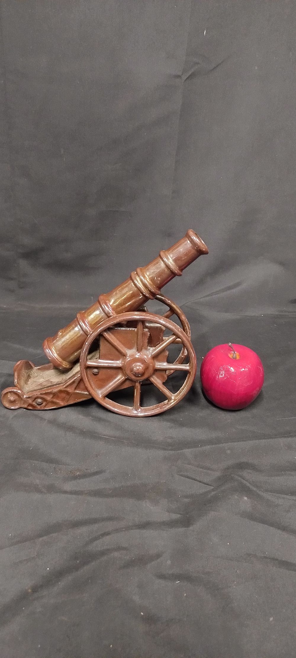 Lot 231: Heavy Cast Iron cannon With a brown Lustre...