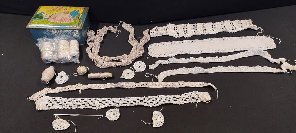 Lot 234: Vintage tin containing various lace crochet pieces, threads...