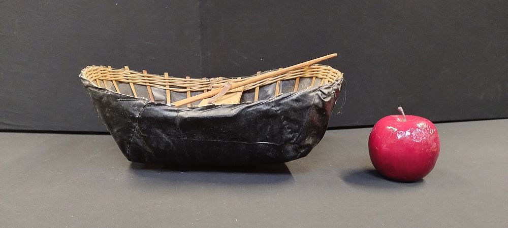 Lot 237: Hand made replica Welsh Conical with oar. Measures...