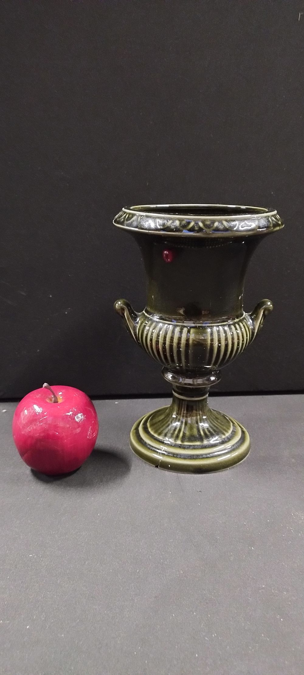 Lot 243: Dartmouth Pottery urn vase with a dark green...