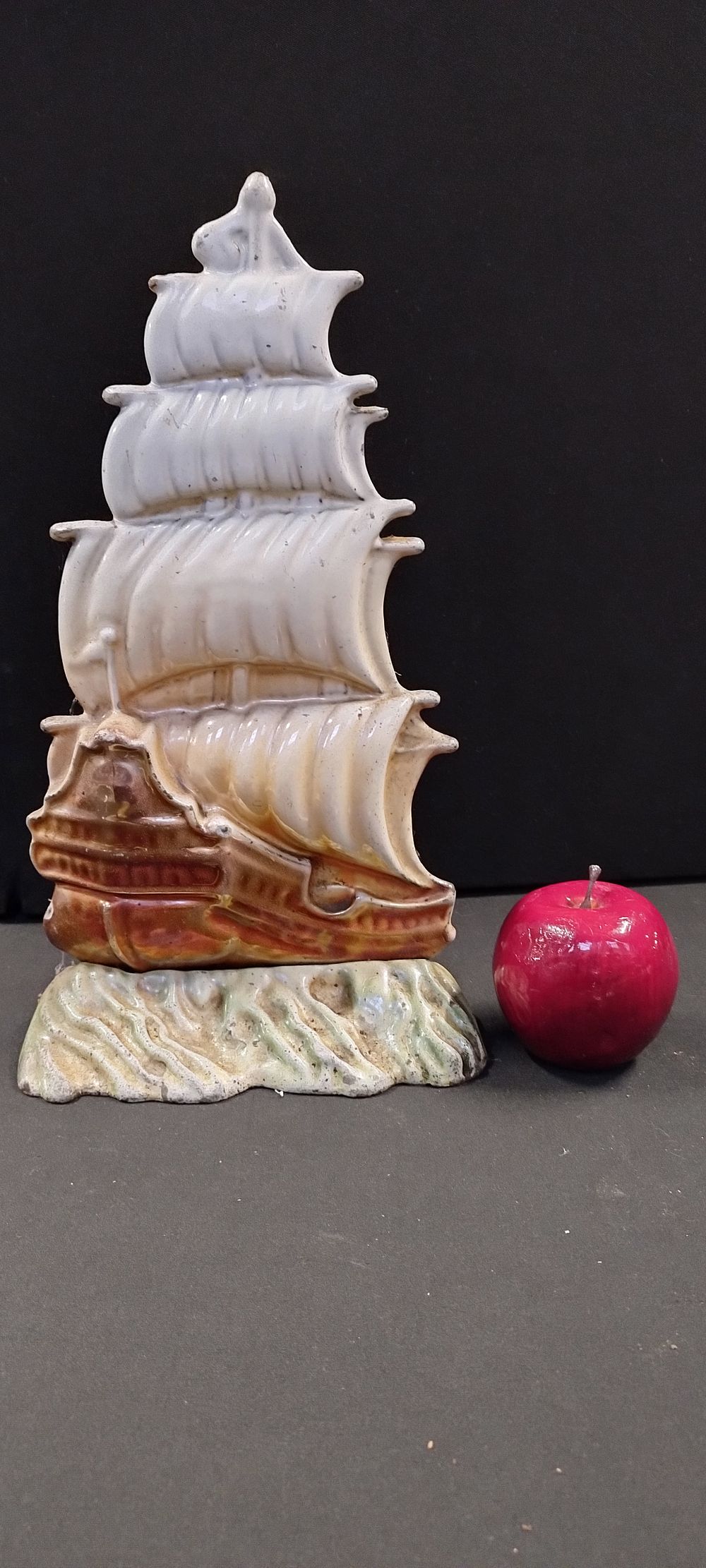 Lot 247: Cast metal sail ship door stop. Measures approx...