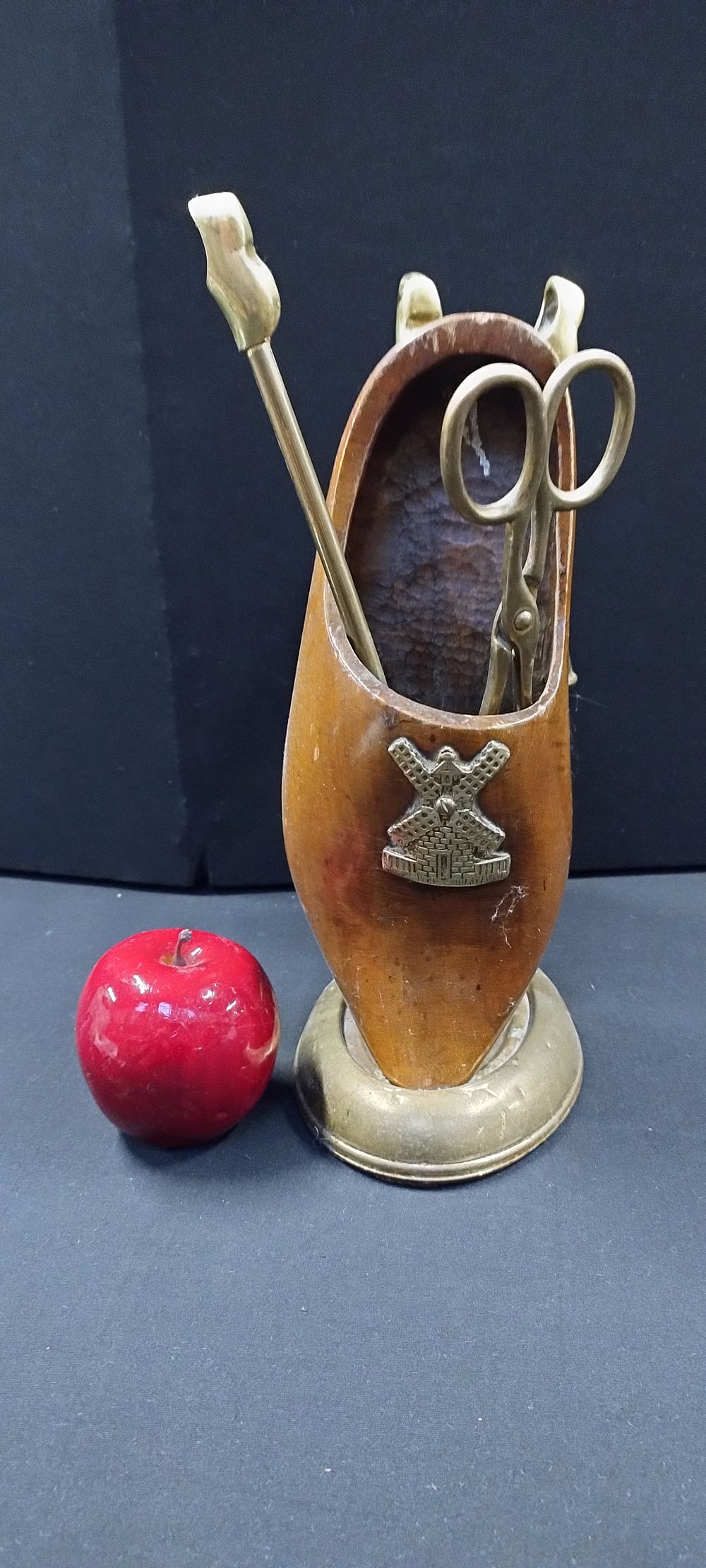 Lot 253: Brass fire companion with a wooden clog storage...