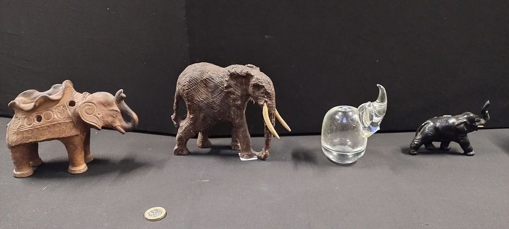 Lot 256: Four various elephants made of different materials