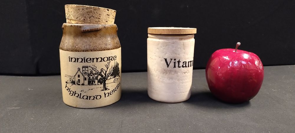 Lot 270: Two stoneware jars with cork stoppers, highland herbs...