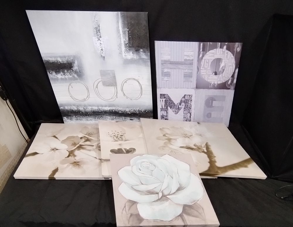 Lot 275: Six wall canvases 4 featuring flowers and 2...