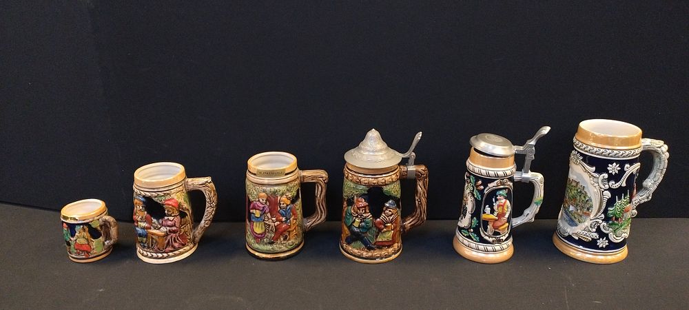 Lot 304: 6 various design German beer steins some with...