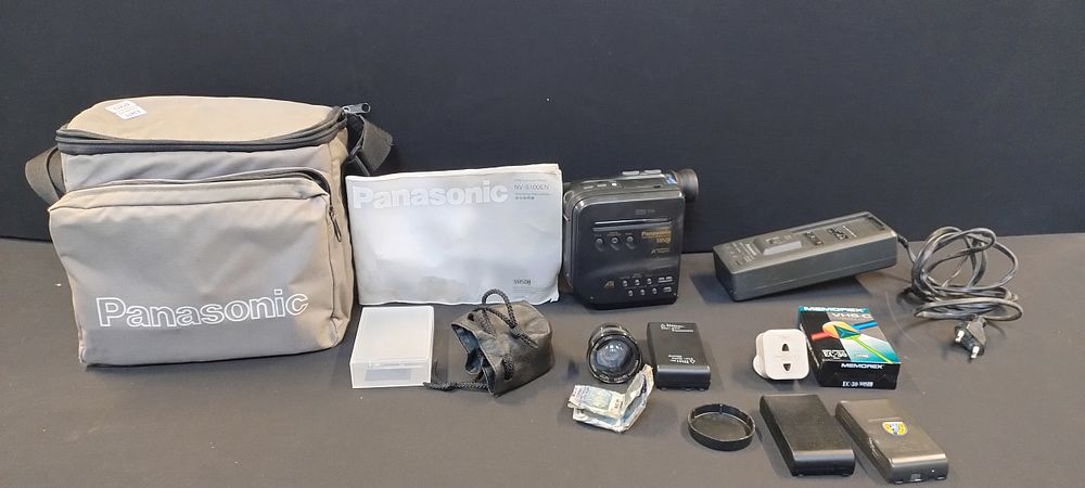 Lot 324: Panasonic VHS-C Movie camera. NV S100. Battery charger,...