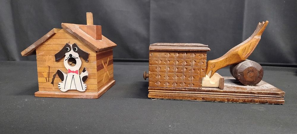 Lot 343: Two vintage wooden cigarette dispensers. One has marqrity...