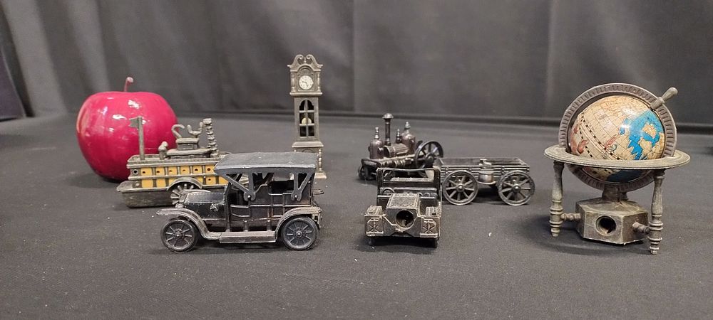 Lot 344: Collection of cast metal pencil sharpeners, globe, cars,...