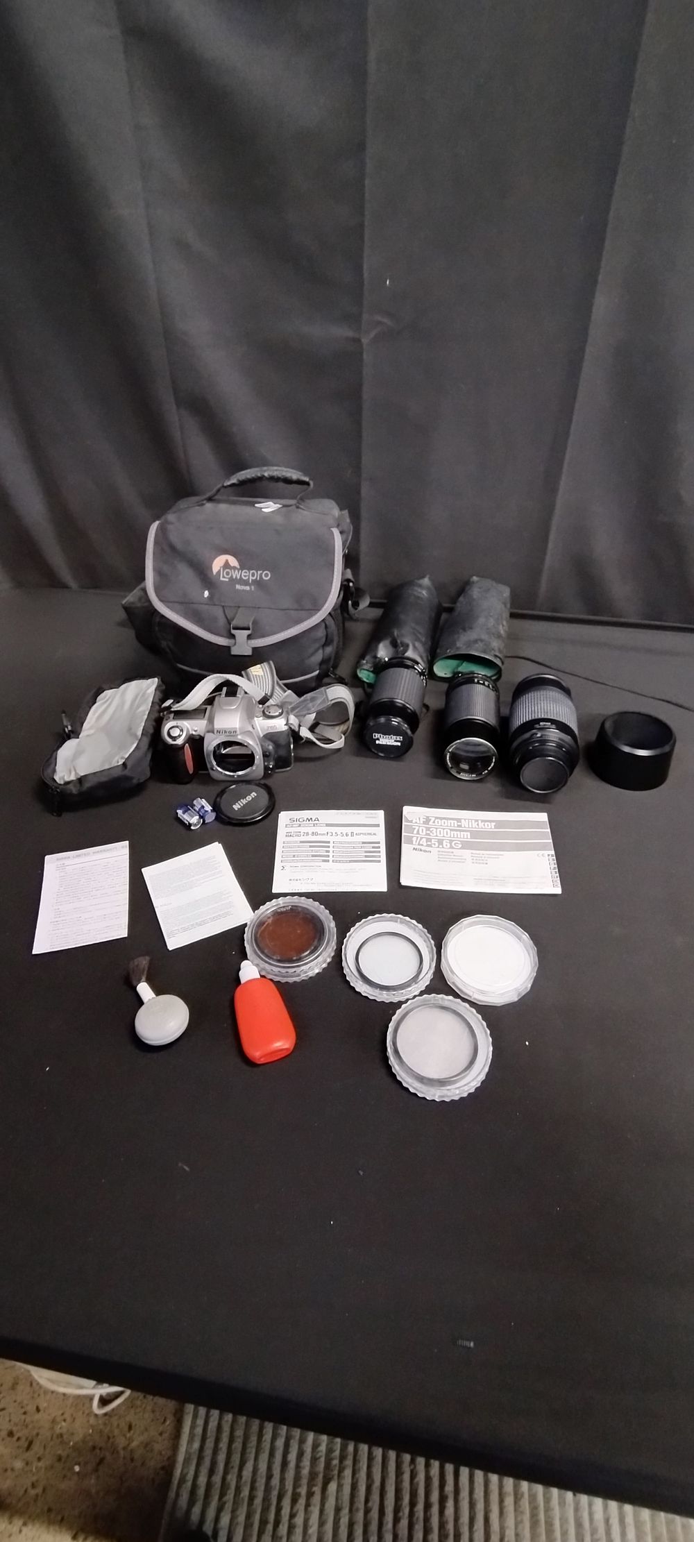 Lot 345: Nikon F65 film camera with 3 lenses,Nikon 1:4-5.6...
