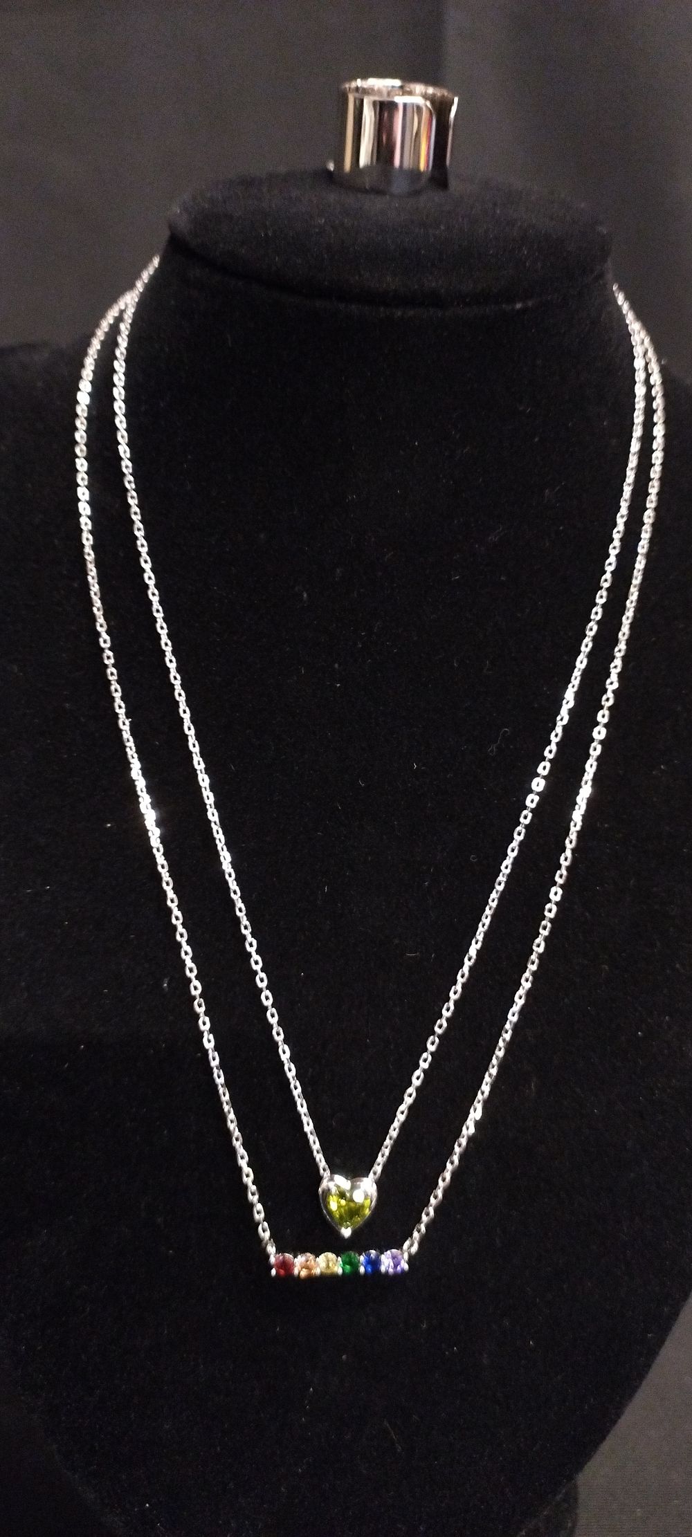 Lot 359: Sterling silver plain adjustable ring and two chains...