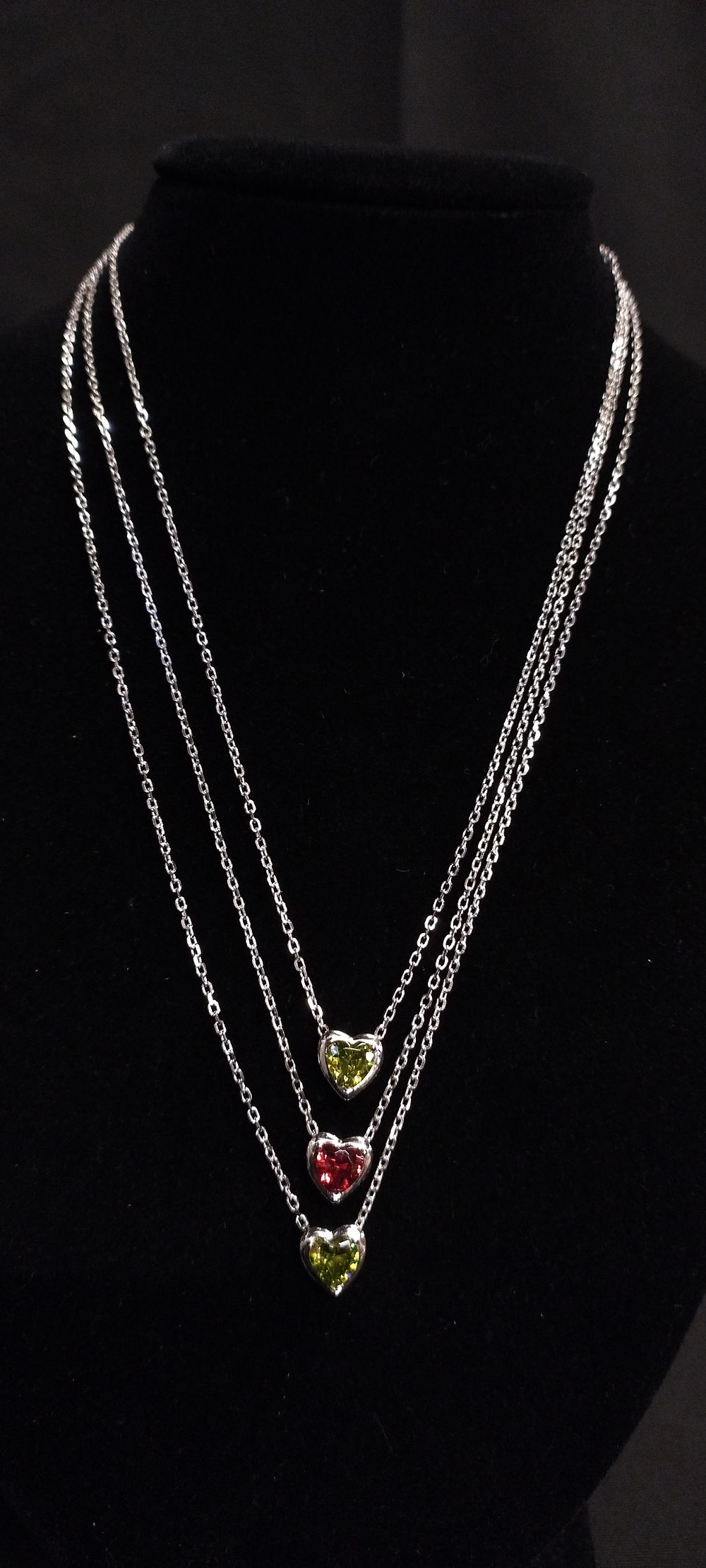 Lot 360: Three sterling silver chains with heart pendants set...