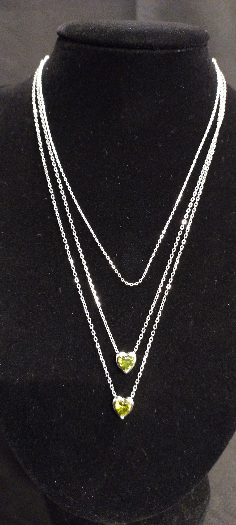 Lot 361: Three sterling silver necklaces two with heart pendants...