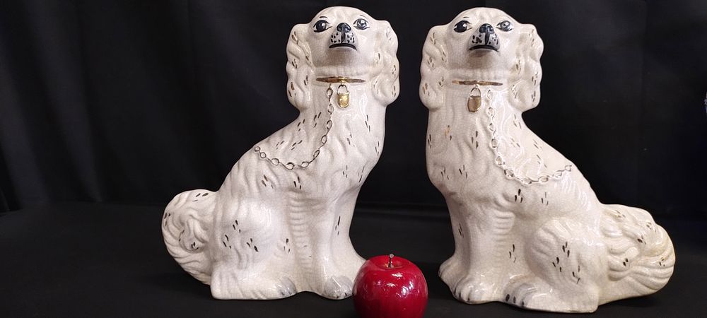 Lot 374: Pair of Staffordshire seated flat backed mantle dogs...