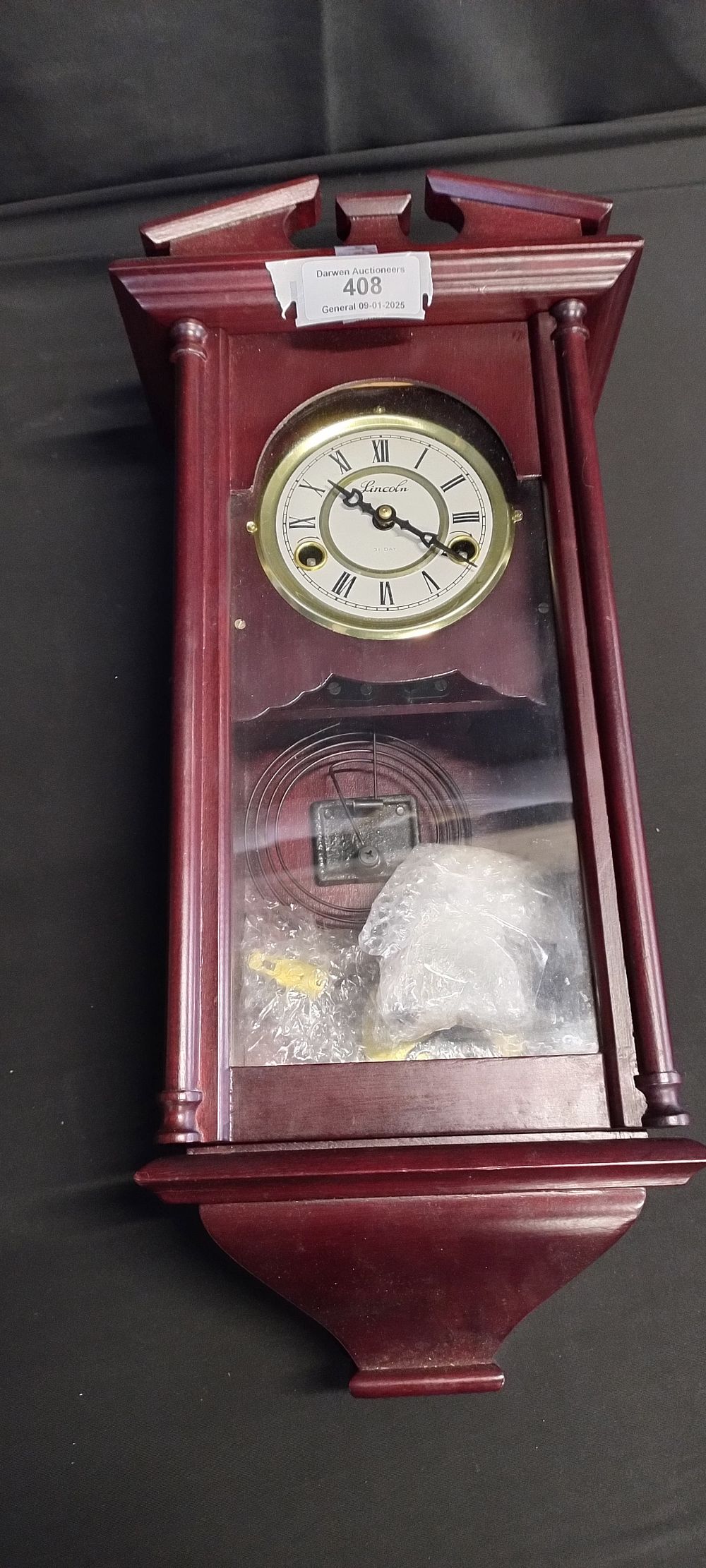 Lot 408: Mahogany Lincoln 31 day pendulum wall hanging clock...