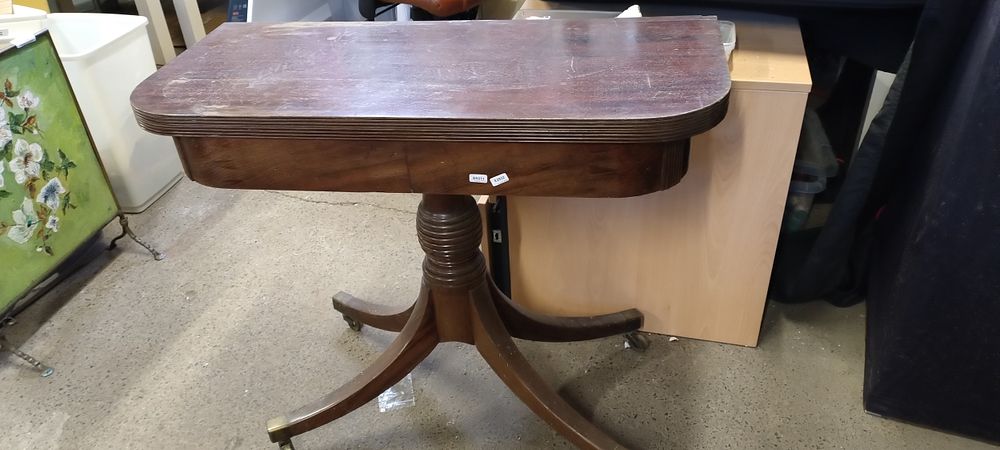 Lot 416: Mahogany Half folding Pembroke table with brass casters....
