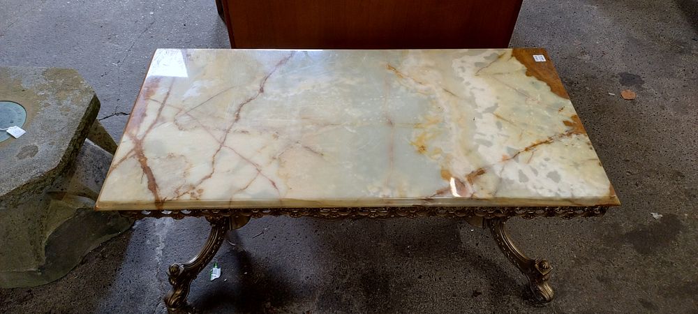 Lot 429: Marble and brass coffee table. Measures approx H...