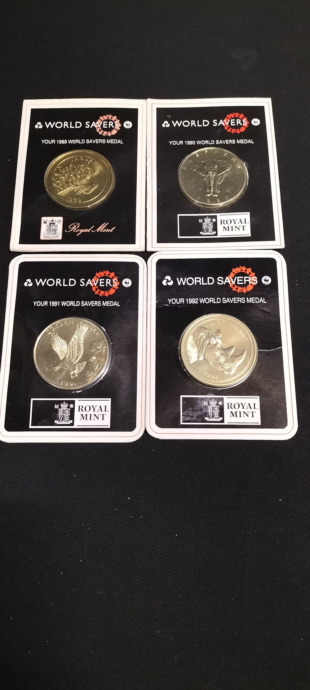 Lot 159: Four Royal Mint world savers coins produced for...