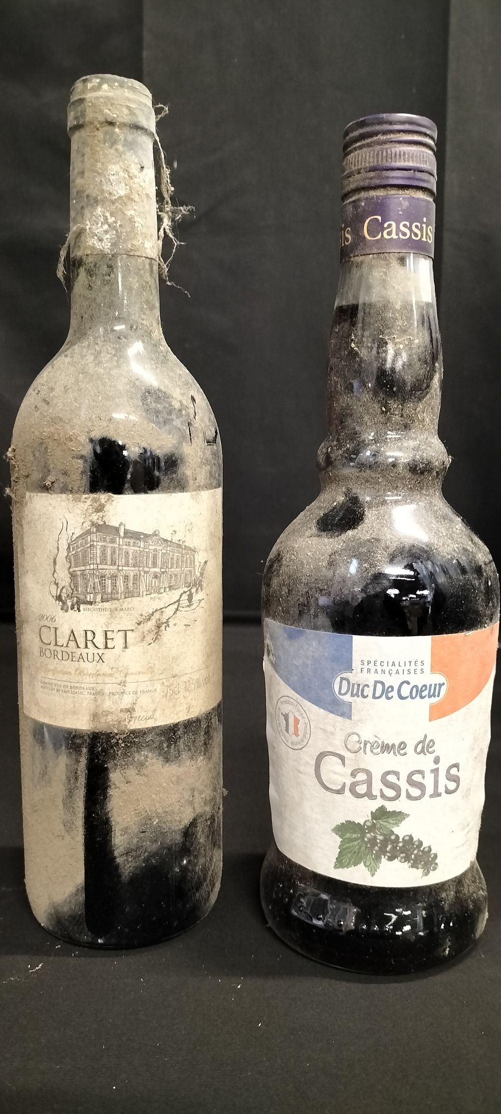 Lot 197: Two bottles of alcohol. A 2006 Claret Bordeaux...