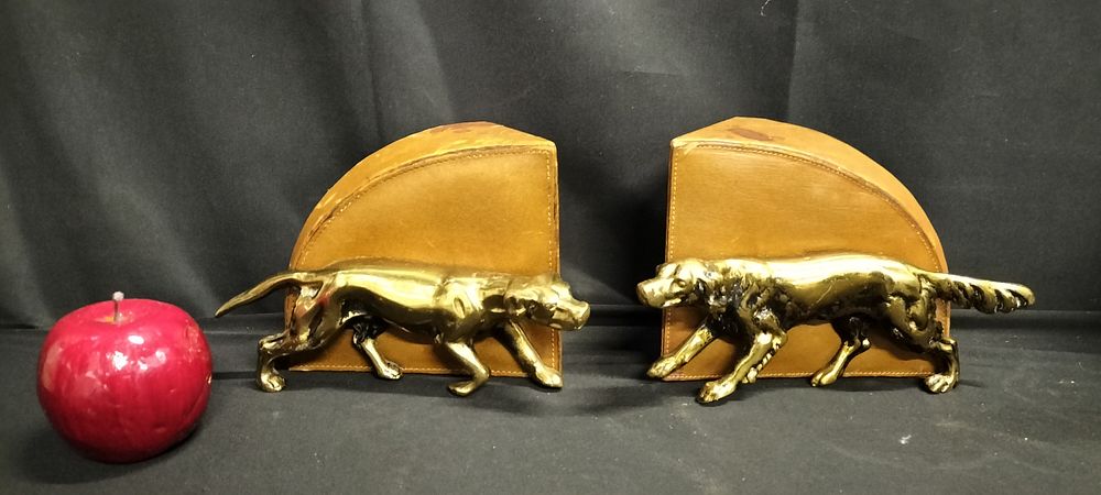 Lot 229: Pair of Brass dog and leatherette book ends.