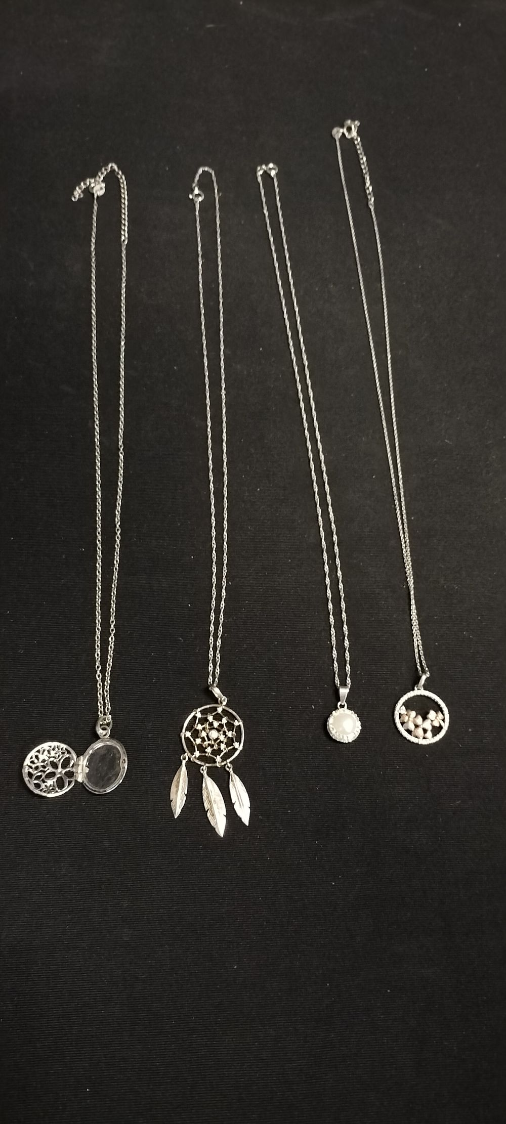 Lot 233: 4 sterling silver necklaces with pendants