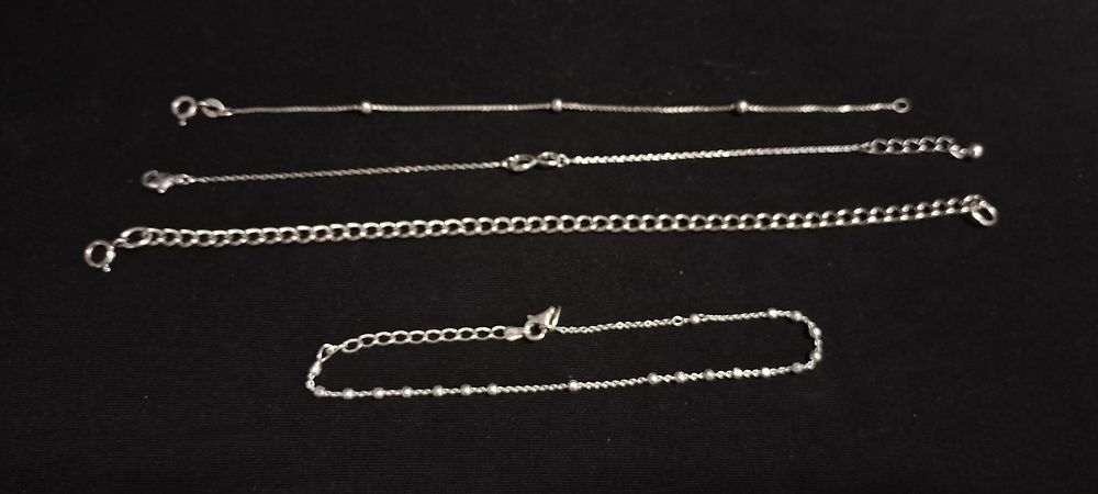Lot 234: Four sterling silver bracelets of various designs