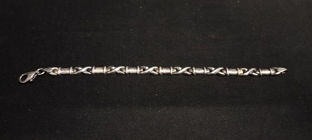 Lot 242: Sterling silver hallmarked cross and link bracelet
