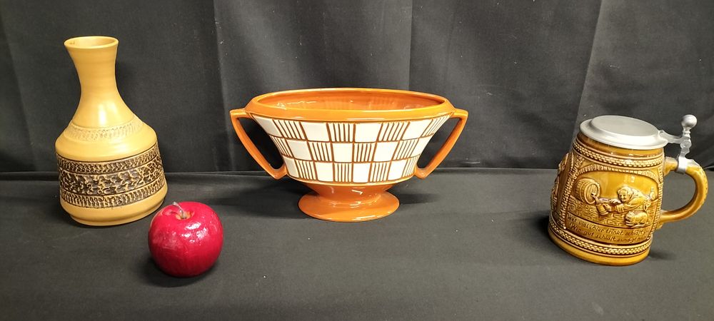 Lot 204: Three items of pottery including Purbeck vase, German...