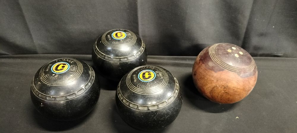 Lot 223: 3 x lawn balls and a wooden ball