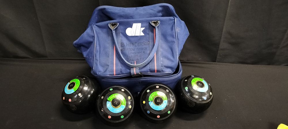 Lot 224: Four lawn balls with carry bag