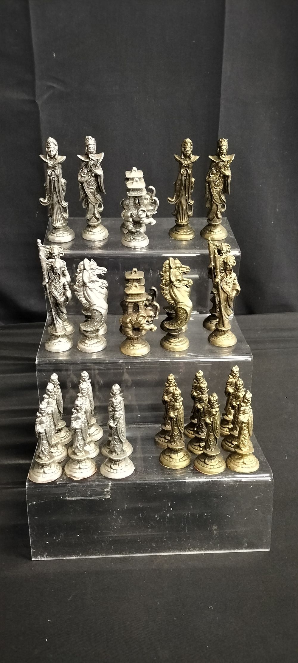 Lot 233: 32 Chinese Metal chess pieces silver and gold...