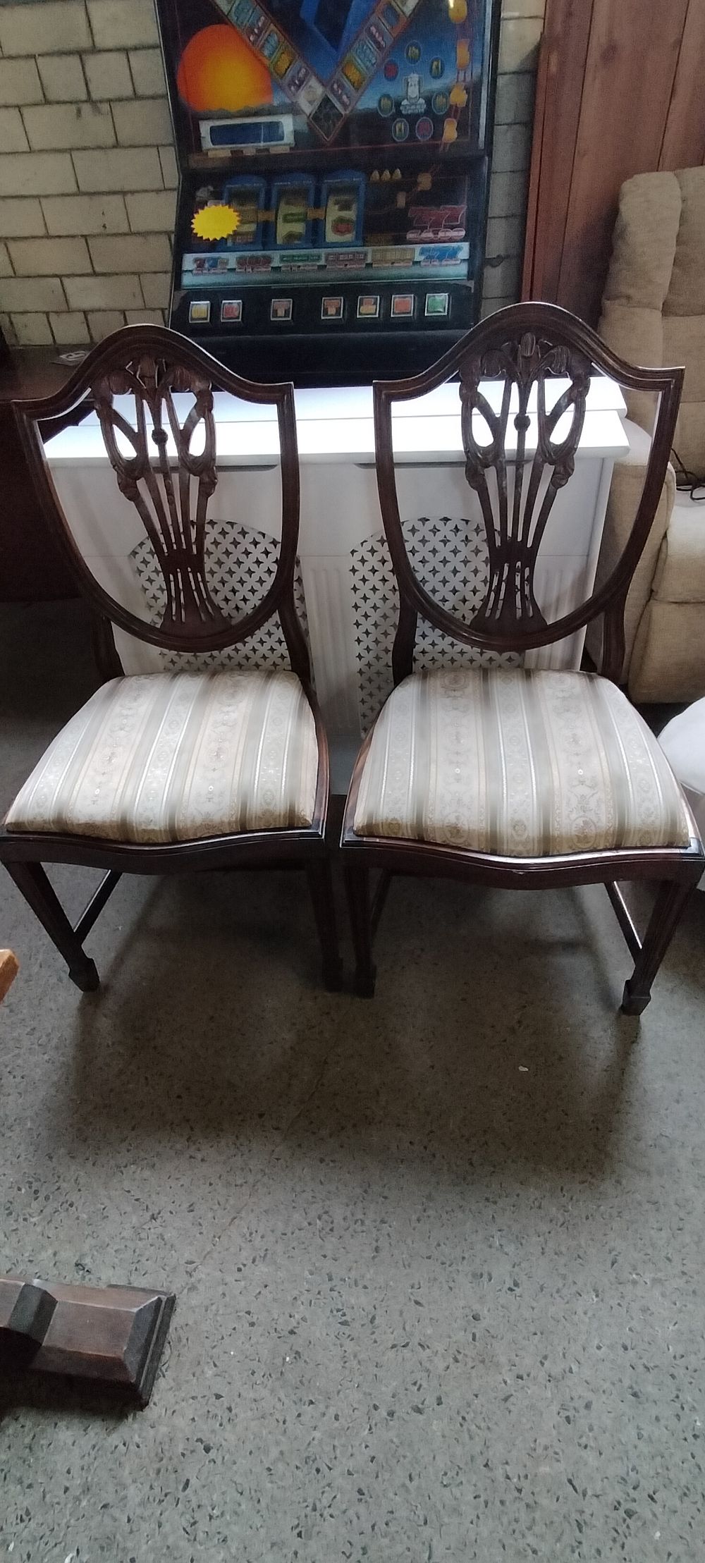 Lot 243: Two mahogany Prince of Wales backed dining chairs