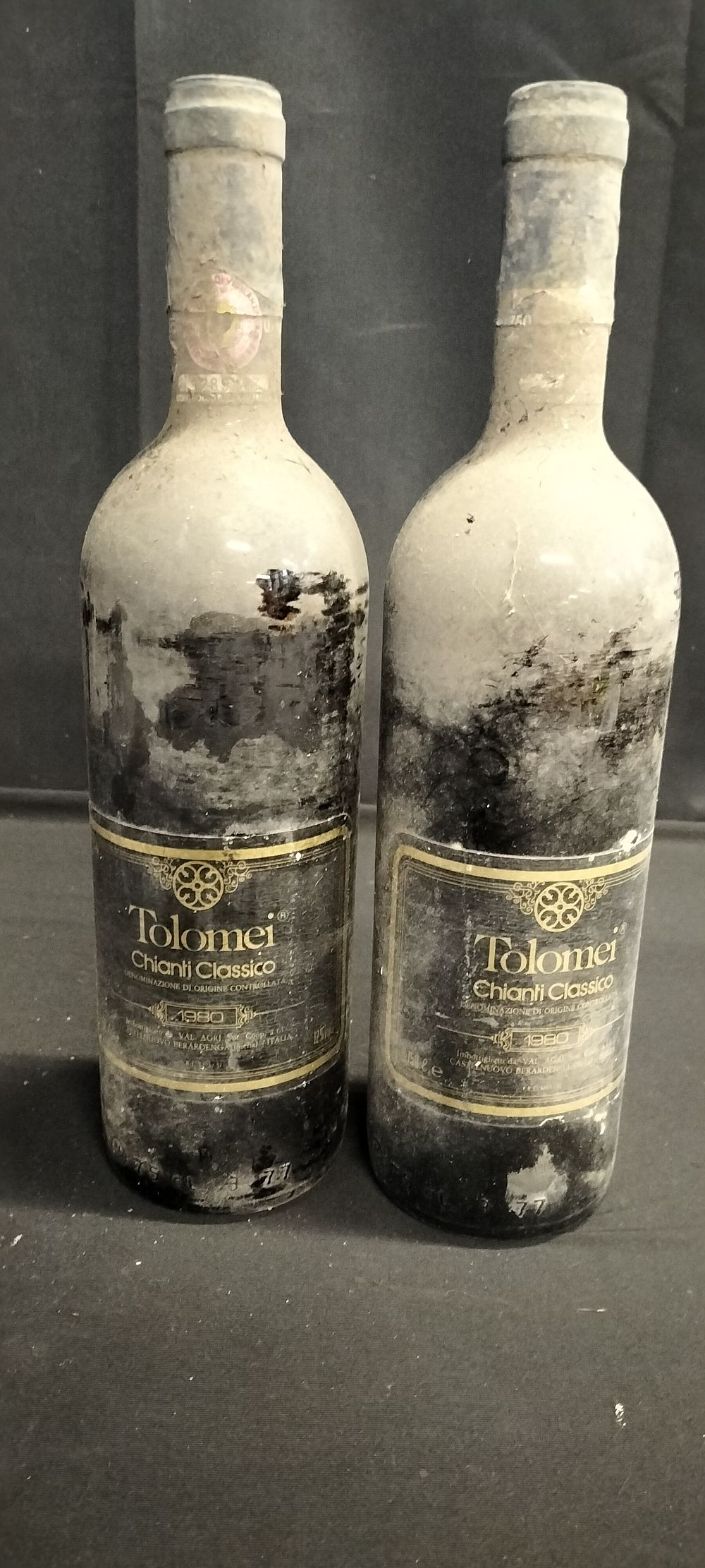 Lot 255: Two bottles of unopened red wine. 1980 Tolomei