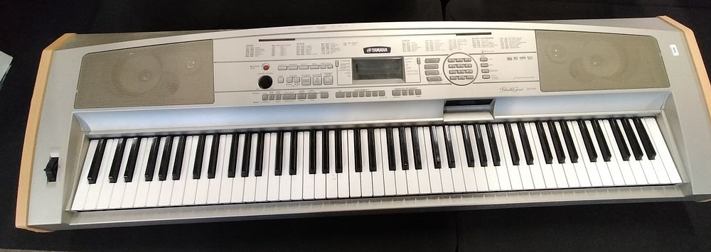 Lot 294: Yamaha Portable Grand electric piano with power supply
