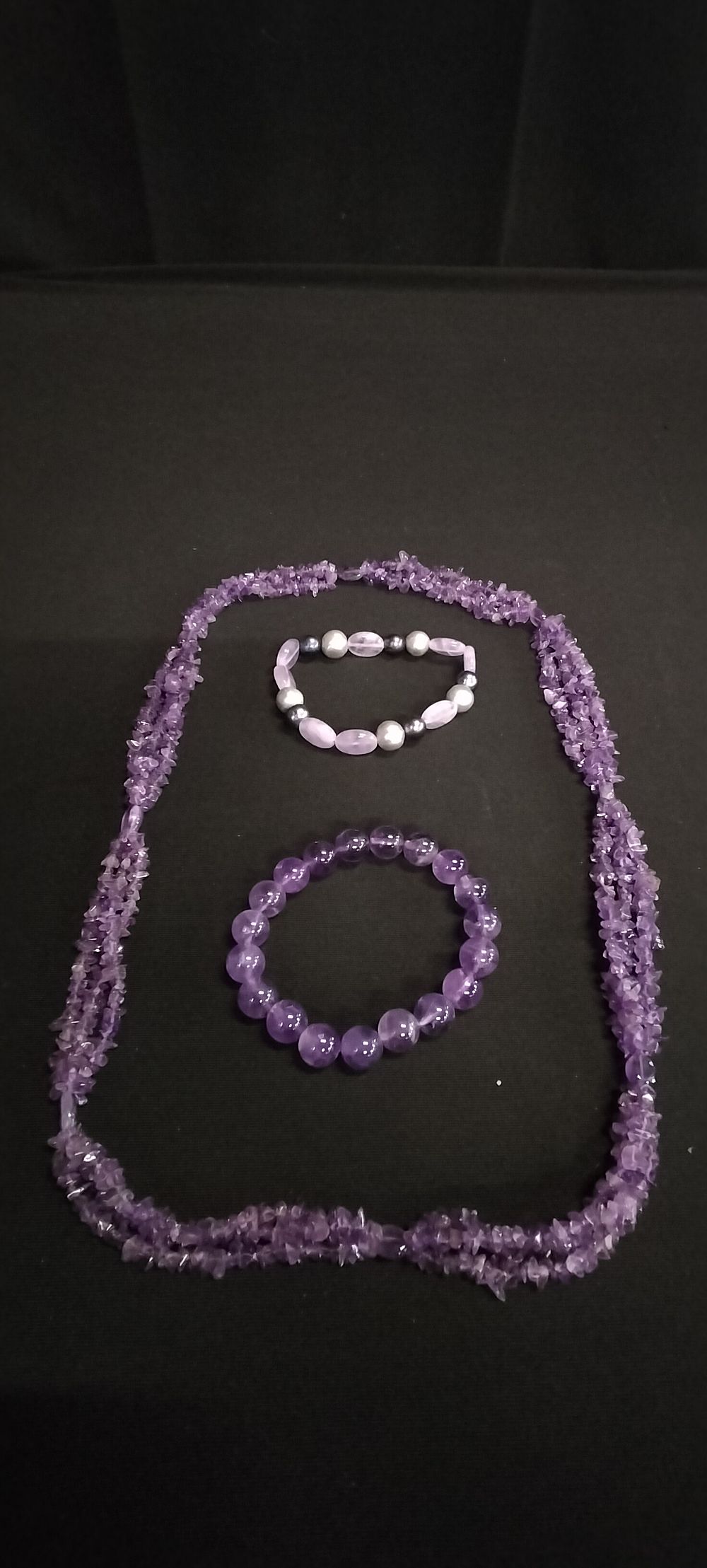 Lot 168: Amethyst necklace and two bracelets