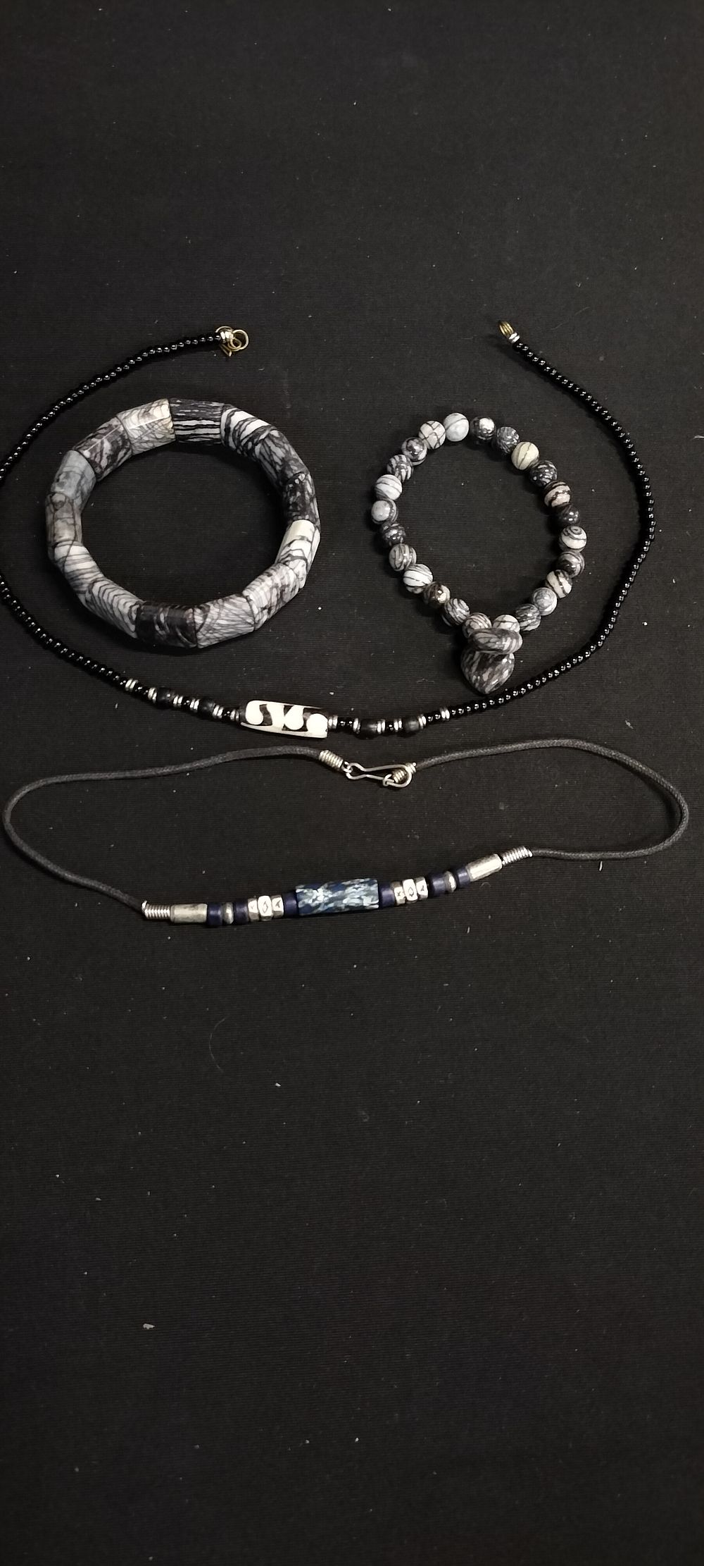 Lot 184: Two necklaces with various coloured central pendants and...